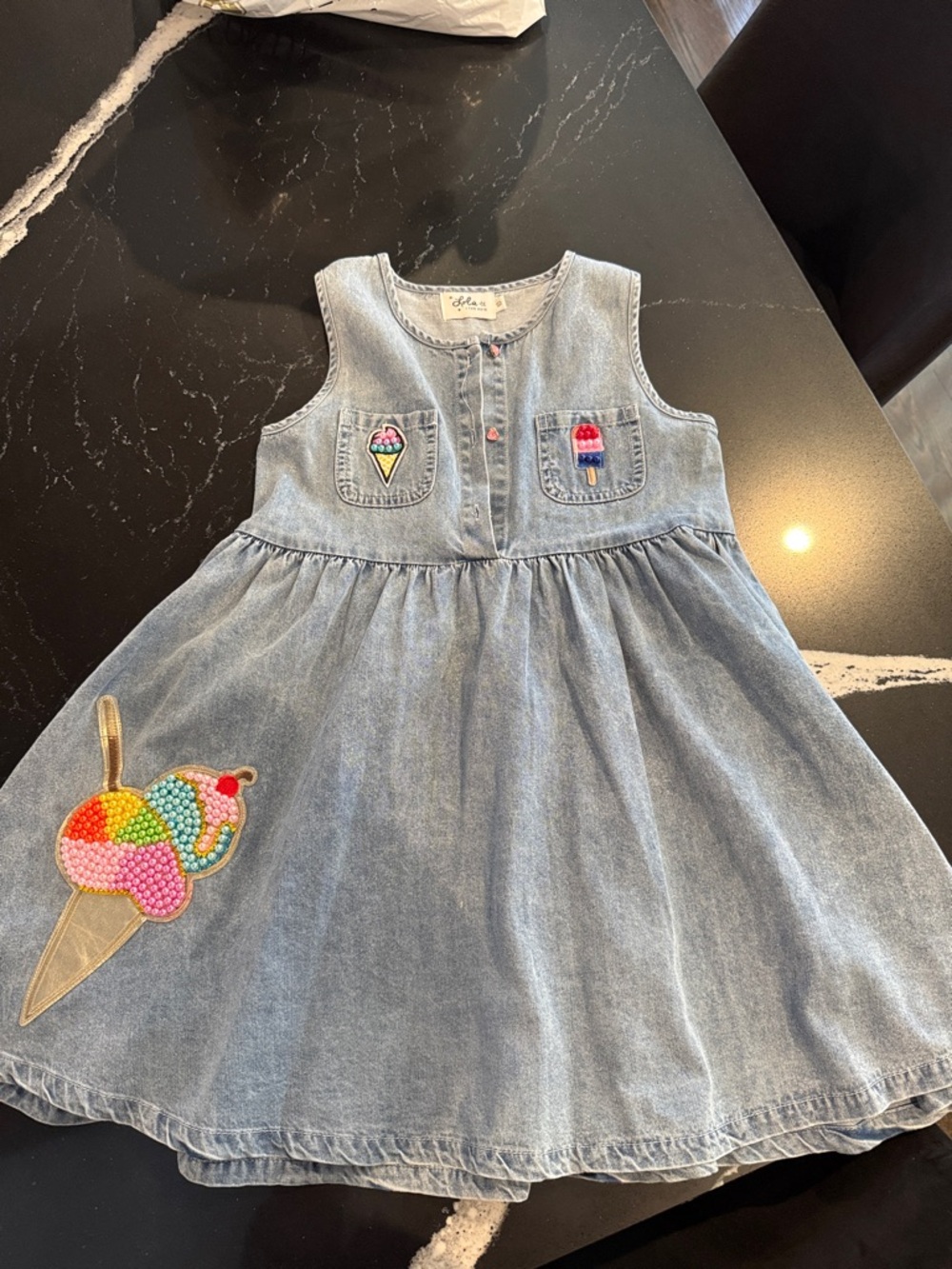 lola Light Wash Denim Top with Pink Buttons and Embroidered Details size 10